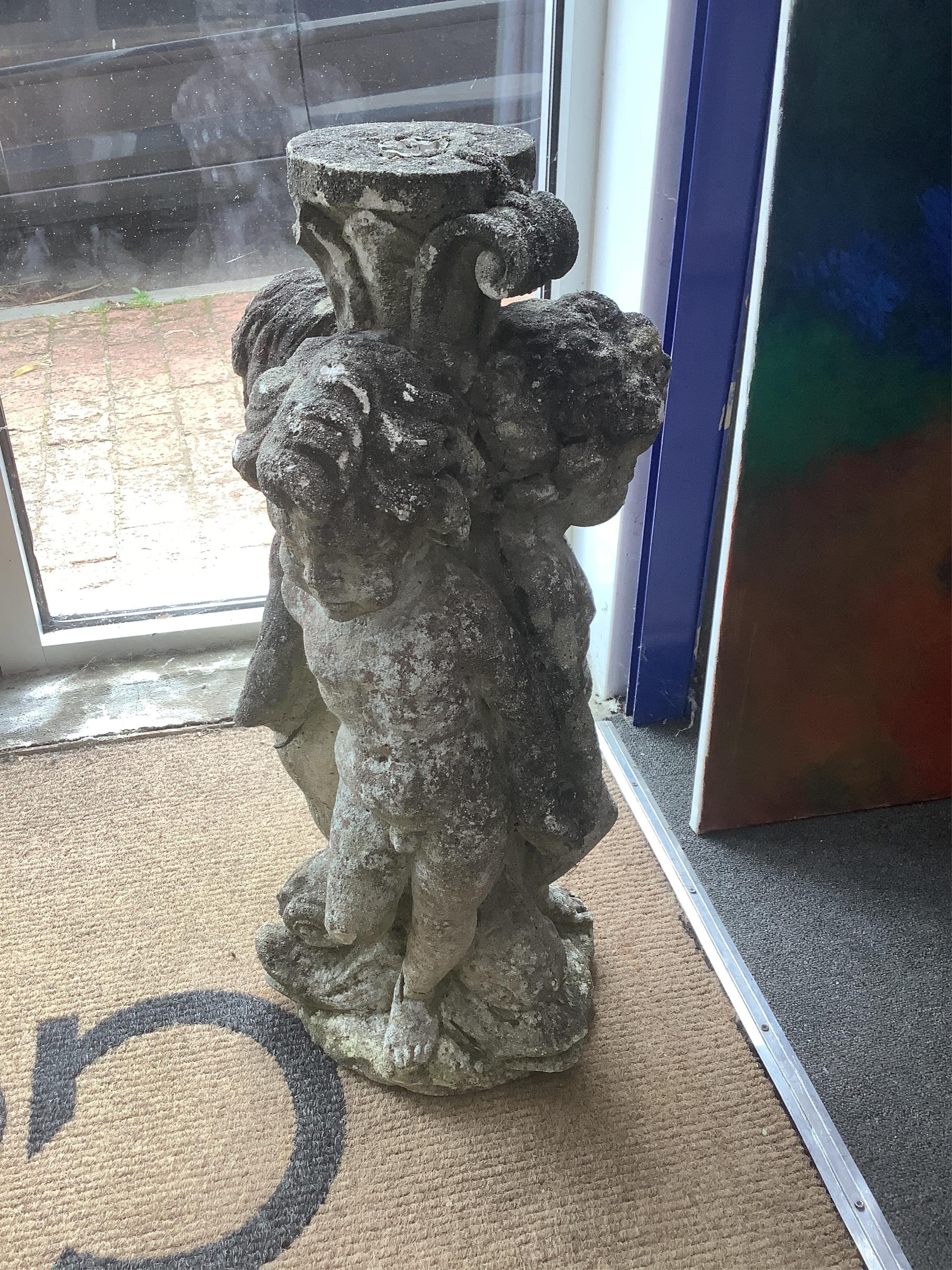 A pair of reconstituted stone triple cherub garden ornaments, height 70cm. Condition - fair